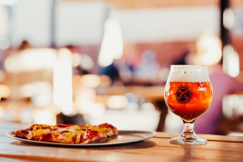 Beer and pizza on a table