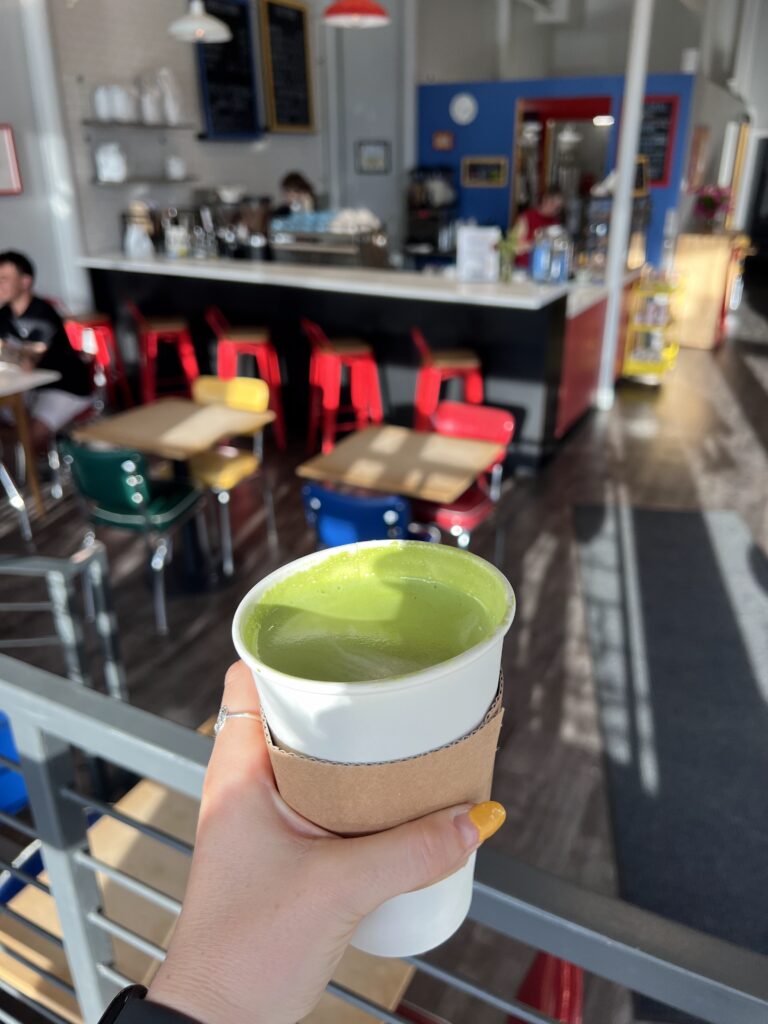 Inside Art Club Coffee in LoHi with a Matcha Latte